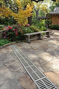  Residential and commercial patio and decks channel drains grates to facilitate the drainage to prevent the ponding water in your Fort Worth Texas landscape 